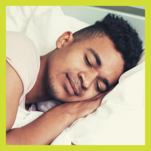 Young man with head on pillow sleeping