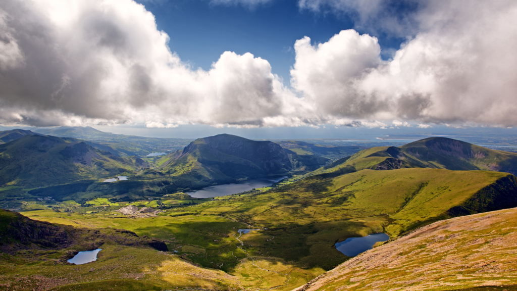 Grassy mountain range with lakes and fluffy white clouds - Eryri (Snowdonia) 